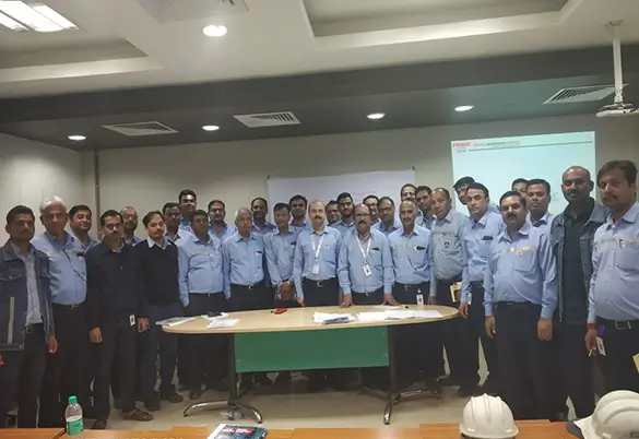 Prism Johnson employees attending a corporate training and development session, group photo in training room