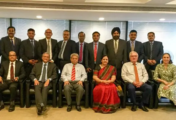 Leadership team of Prism Johnson posing for a formal group photo, representing the company’s professional & work culture