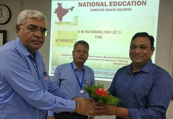 Prism Johnson training session where an employee is being felicitated with a bouquet during a development programme